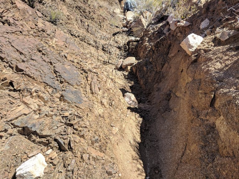 Contact between the Titanium/ Vanadium mineralised vein and the country rock consisting of red granite.